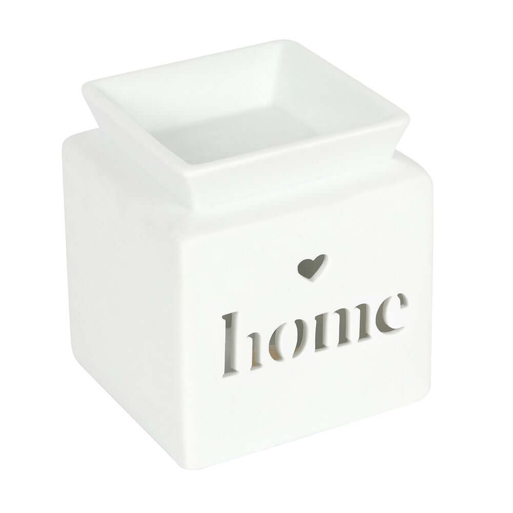 White ceramic wax melter with cut-out and the word 'home' in a modern, minimalist design.